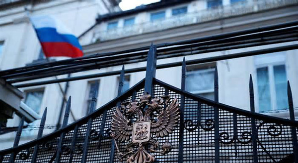 Russia's flag flies from the consular section of its embassy, in central London, Britain